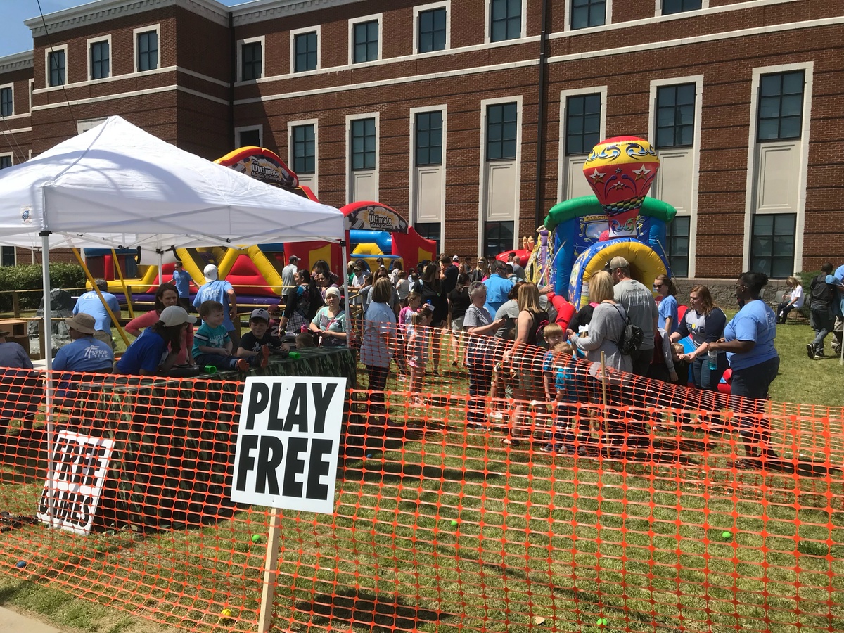 Play Free sign in front of orange protective fence.