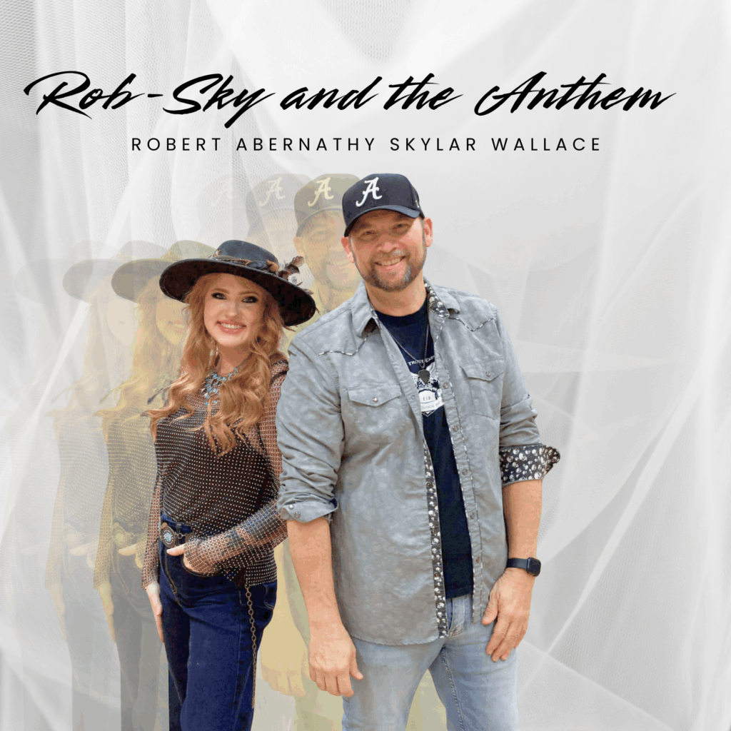 man and woman posing in front of white curtain.
